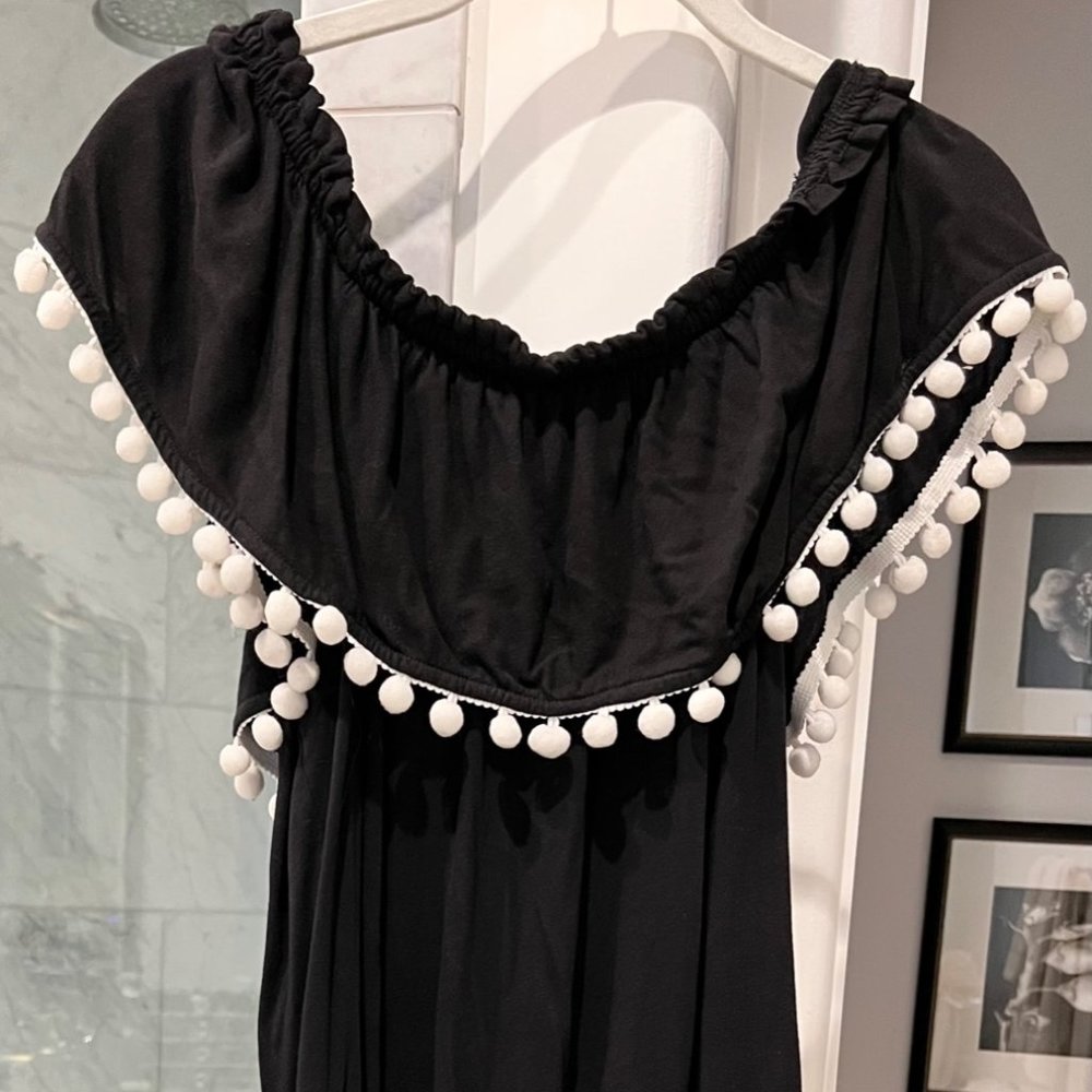 Black dress with white pom poms